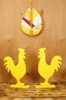 Two yellow wooden rooster figures