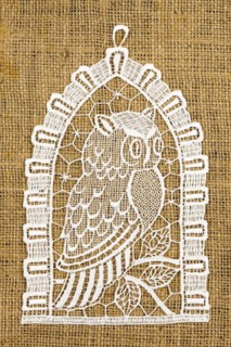 Crocheted Owl on Linen Background
