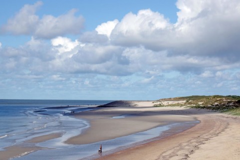 Wide sandy beach with few people