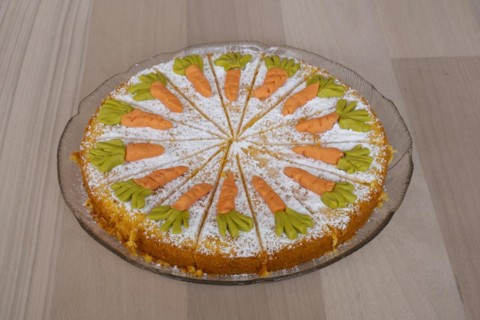 Homemade carrot cake on a glass plate