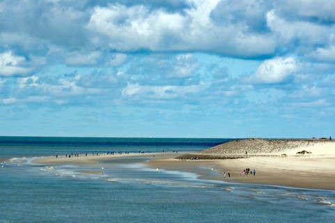 Wide sandy beach with few people