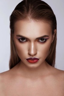 Beautiful caucasian woman with creative makeup and purple lips. Beauty face. Art makeup