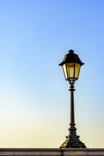 Old colonial style lamppost on the walls of the streets of Salvador