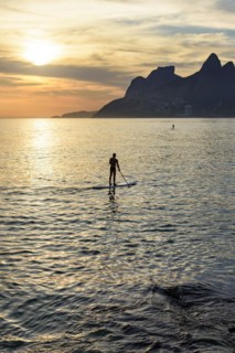Stand up paddle at Ipanema beach in Ipanema during sunset