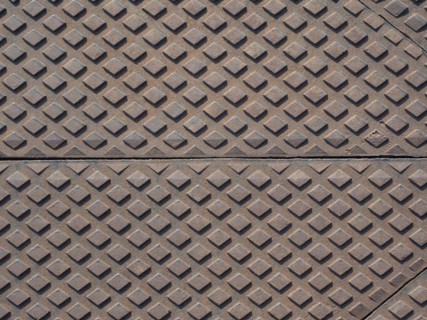 Steel diamond plate useful as a background