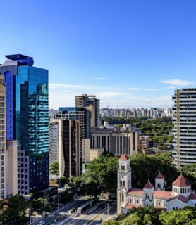 View of the modern city of Sao Paulo and its buildings forming a wall of buildings in the background on a sunny day