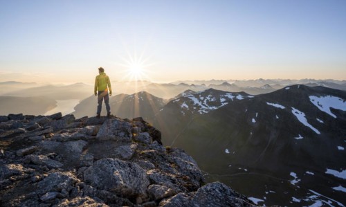 Hiker looking into the sunset