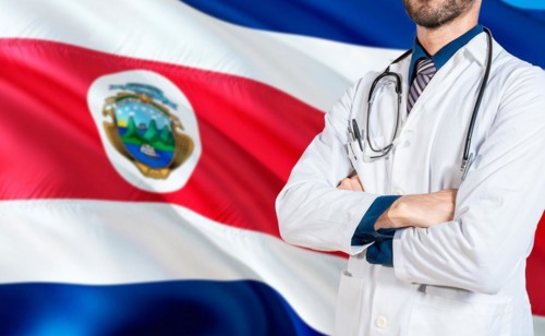 Costa Rica national health concept. Doctor with crossed arms on Costa Rica flag