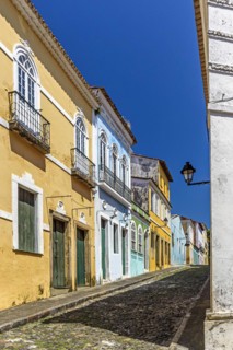 Cobbled streets and slopes and colorful colonial-style historic houses in the Pelourinho district of Salvador