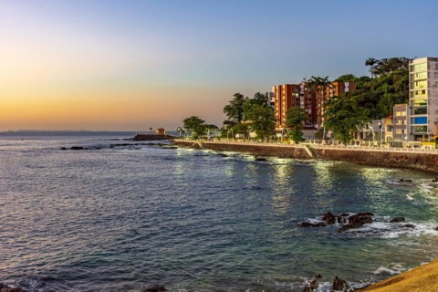 Seafront in the tourist region of the city of Salvador in Bahia during sunset with the sea