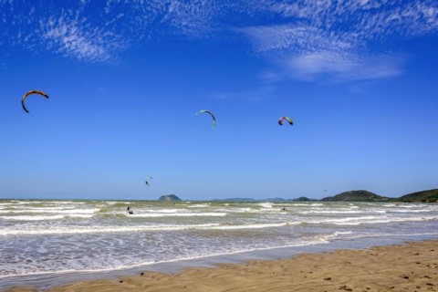 Kitesurfers enjoying the wind and waves of Rasa beach in Buzios in the state of Rio de Janeiro