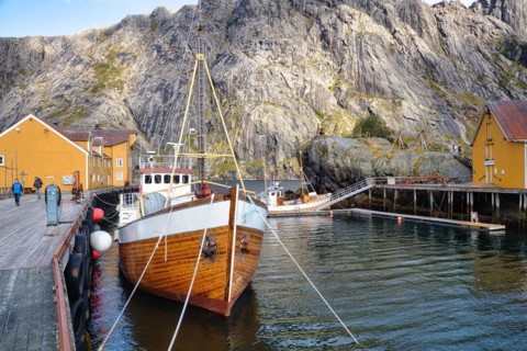 Historic buildings and fishing boats in Nusfjord harbour