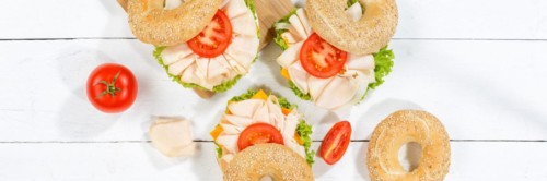 Bagel sandwich for breakfast topped with chicken ham from above Panorama in Stuttgart