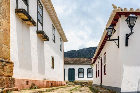 Cobblestone street in the historic city of Tiradentes in Minas Gerais among old colonial style houses