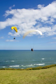 Paragliders flying over the sea in the city of Torres in the state of Rio Grande do Sul