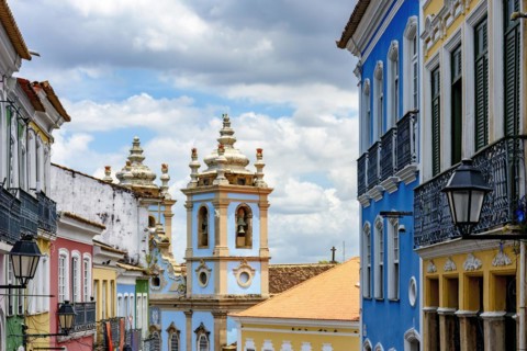 Colorful facades of old houses and historic church in Pelourinho neighborhood in Salvador city