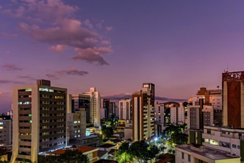 Neighborhood of the city of Belo Horizonte in Minas Gerais with its buildings lit up by the sunset