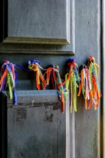 Famous colorful ribbons of good luck from Our Lord of Bonfim tied to the door of the church in Salvador
