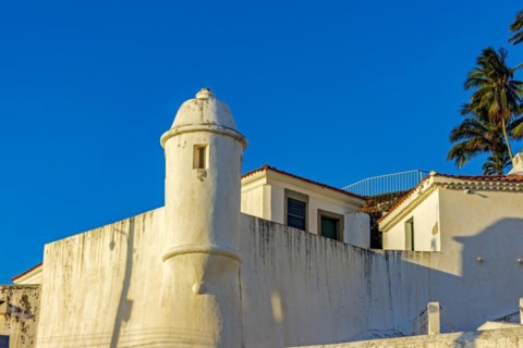 Walls and guardhouse of an old colonial fortification in the city of Salvador in Bahia illuminated by the sunset