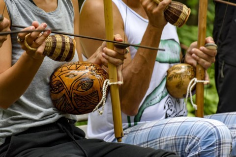 Afro Brazilian percussion musical instruments during a capoeira performance in the streets of Brazil