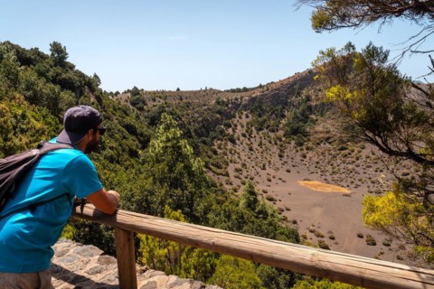 A young man at the Fireba volcano viewpoint of La Llania park in El Hierro