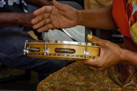 Tambourine being played by a ritimist during a samba performance in brazilian carnival in Rio de Janeiro