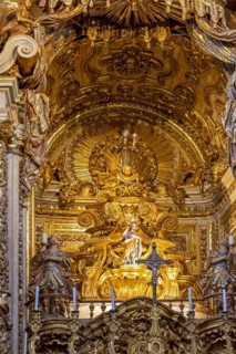 Interior and altar of historic church all painted in gold with baroque architecture in the old city of Tiradentes in Minas Gerais state