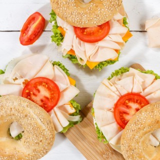 Bagel sandwich for breakfast topped with chicken ham from above square in Stuttgart
