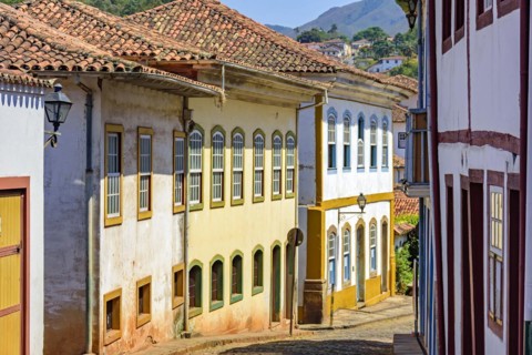 Quiet street with old colorful houses in colonial architecture