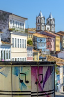 Colorful drum with the Pelourinho district with its historic and colorful houses and churches in the background in the city of Salvador