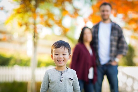 Outdoor portrait of multiethnic chinese and caucasian family