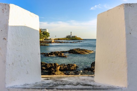 Famous Barra Lighthouse seen through the walls of the old fortress of Santa Maria in the city of Salvador in Bahia