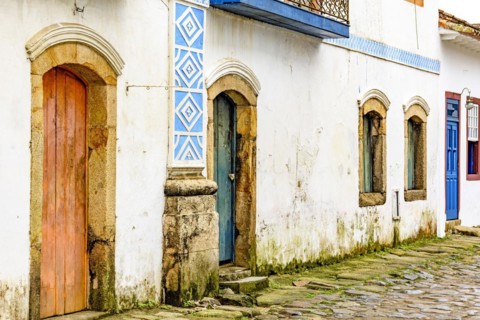 House facade in weather-damaged colonial architecture on cobblestone street in the historic city of Paraty in the state of Rio de Janeiro