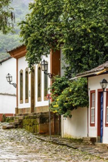 Colonial houses with colorful facades and cobblestone slopes in the historic city of Tiradentes