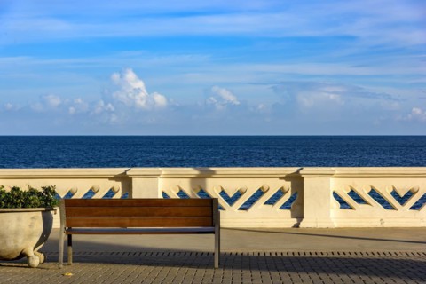 Wall and sidewalk overlooking the sea on a summer afternoon in the city of Salvador