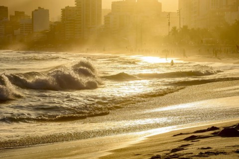 Summer sunset at Ipanema beach in Rio de Janeiro with its sea