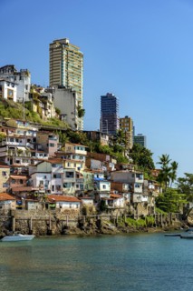 Slum over the sea of the city of Salvador in Bahia with the buildings in the background on a sunny afternoon