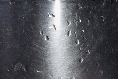 Water drops on grey steel texture background