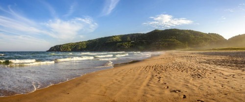 Image of stunning Tucuns beach in city of Buzios coast of Rio de Janeiro at dusk