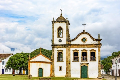 Old streets with historic church facade and houses in colonial architecture in the city of Paraty