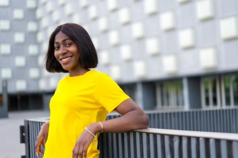 Summer Breeze: A Stylish Black Woman Soaks Up the Sun in the City