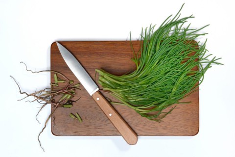 Monk's beard with knife on wooden board
