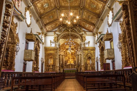 Interior and altar of historic church all painted in gold with baroque architecture in the old city of Tiradentes in Minas Gerais state