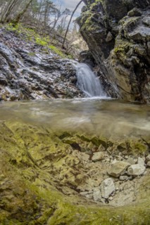 Underwater photo of a mountain stream with waterfall in the Kalkalpen National Park