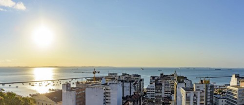 Buildings and port of the city of Salvador with the bay of All Saints in the background during sunset in Bahia state