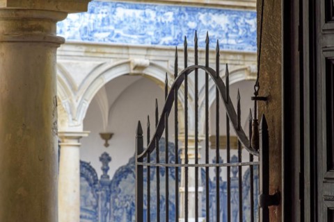 Arches and gate in the inner courtyard of an old historic convent in the city of Salvador