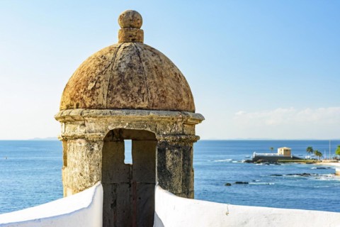 Stone guardhouse on the walls of an old colonial-style fort on the seafront of Salvado in Bahia