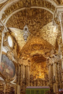 Interior and altar of historic church all painted in gold with baroque architecture in the old city of Tiradentes in Minas Gerais state