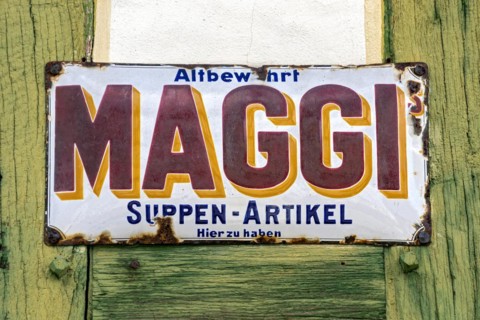 Rusty historical enamel sign