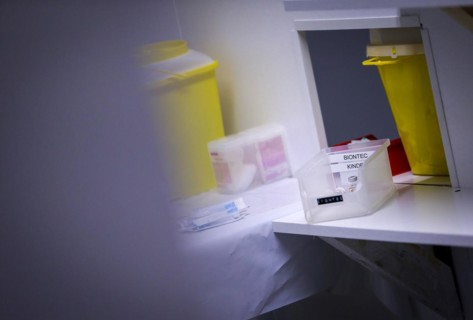 Drawn-up syringes with the BioNTech Pfizer vaccine for children lie ready for use in a COVID-19 vaccination and testing centre at the Olsen car dealership in Iserlohn